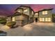 Two-story house with a large driveway and landscaping at 4628 W Hasan Dr, Laveen, AZ 85339
