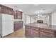 Kitchen with granite countertops, a refrigerator, and a view into the living area at 4628 W Hasan Dr, Laveen, AZ 85339