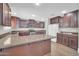 Well-equipped kitchen with a large island, granite countertops, and ample cabinet space at 4628 W Hasan Dr, Laveen, AZ 85339