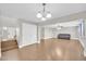 Open-concept living area with hardwood floors, stairs, and a comfortable sofa at 4628 W Hasan Dr, Laveen, AZ 85339