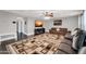 Living room with a large sectional sofa and a flat-screen TV at 4628 W Hasan Dr, Laveen, AZ 85339