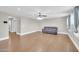 Spacious living room with wood flooring and modern ceiling fan and recessed lighting at 4628 W Hasan Dr, Laveen, AZ 85339