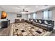 Relaxing living room featuring a sectional sofa and stylish rug at 4628 W Hasan Dr, Laveen, AZ 85339