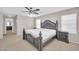 Main bedroom with ceiling fan and bed, featuring carpeted floors and natural light at 4628 W Hasan Dr, Laveen, AZ 85339