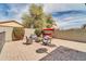 Brick patio with seating area and firepit at 4628 W Hasan Dr, Laveen, AZ 85339