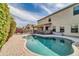 Relaxing kidney-shaped pool with patio at 4628 W Hasan Dr, Laveen, AZ 85339