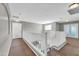 Upstairs hallway with carpet and white railing at 4628 W Hasan Dr, Laveen, AZ 85339