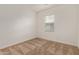 Bright bedroom with neutral-toned carpeting and a window at 4707 S Vapor Dr, Mesa, AZ 85212