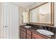 Double vanity bathroom with granite countertops at 5102 N 31St Pl # 422, Phoenix, AZ 85016