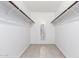 Spacious walk-in closet with ample shelving and tile flooring at 5102 N 31St Pl # 422, Phoenix, AZ 85016