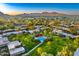 Community overview showcasing lush landscaping, pool, and mountain views at 5652 N Scottsdale Rd, Paradise Valley, AZ 85253