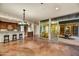 Spacious kitchen with island, dark wood cabinets, and a chandelier at 5652 N Scottsdale Rd, Paradise Valley, AZ 85253