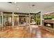 Living room with fireplace, courtyard view, and TV at 5652 N Scottsdale Rd, Paradise Valley, AZ 85253