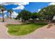 Landscaped backyard with grassy area and trees at 5830 E Mckellips Rd # 100, Mesa, AZ 85215