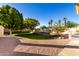 Landscaped backyard with grassy area and trees at 5830 E Mckellips Rd # 100, Mesa, AZ 85215