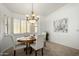 Bright dining room featuring a wood table and chair set at 5830 E Mckellips Rd # 100, Mesa, AZ 85215
