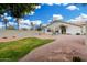Landscaped front yard with a curved lawn at 5830 E Mckellips Rd # 100, Mesa, AZ 85215
