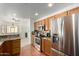 Kitchen with stainless steel appliances and wood cabinetry at 5830 E Mckellips Rd # 100, Mesa, AZ 85215