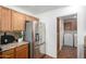 Kitchen features stainless steel refrigerator and wood cabinets at 5830 E Mckellips Rd # 100, Mesa, AZ 85215