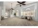 Open living room with multiple seating areas and large windows at 5830 E Mckellips Rd # 100, Mesa, AZ 85215
