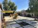 Large backyard with covered patio and desert landscaping at 6307 E Gelding Dr, Scottsdale, AZ 85254