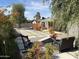 Relaxing backyard patio with seating area and desert landscaping at 6307 E Gelding Dr, Scottsdale, AZ 85254