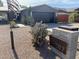 Single story home with gray exterior, landscaped yard, and a modern design at 6307 E Gelding Dr, Scottsdale, AZ 85254