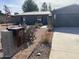 Single story home with gray exterior, landscaped yard, and a modern design at 6307 E Gelding Dr, Scottsdale, AZ 85254