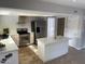 Modern kitchen with stainless steel appliances and an island at 6307 E Gelding Dr, Scottsdale, AZ 85254