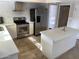Modern kitchen with stainless steel appliances and an island at 6307 E Gelding Dr, Scottsdale, AZ 85254
