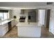 Modern kitchen with stainless steel appliances and an island at 6307 E Gelding Dr, Scottsdale, AZ 85254