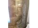 Shower with pebble stone accent wall at 6307 E Gelding Dr, Scottsdale, AZ 85254