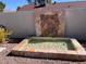 Stone water feature with a small pond and tile accents at 6307 E Gelding Dr, Scottsdale, AZ 85254
