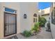 Private courtyard access with wrought iron accents and mature landscaping at 6411 S River Dr # 47, Tempe, AZ 85283