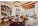 Elegant dining area with a wooden table and high ceilings at 6411 S River Dr # 47, Tempe, AZ 85283