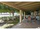 Covered patio with seating and a view of the golf course at 7735 E Desert Flower Ave, Mesa, AZ 85208