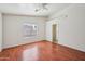 Bright bedroom with hardwood floors and a ceiling fan at 8933 W Catalina Dr, Phoenix, AZ 85037