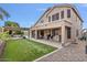 Large backyard with covered patio and artificial turf at 9348 E Grandview St, Mesa, AZ 85207