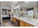 Double vanity bathroom with a large mirror and access to bedroom at 9348 E Grandview St, Mesa, AZ 85207