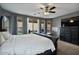 Bright bedroom with a king-size bed and backyard access at 9348 E Grandview St, Mesa, AZ 85207