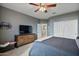 Cozy bedroom with a queen-size bed and ceiling fan at 9348 E Grandview St, Mesa, AZ 85207