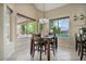 Breakfast nook with table and chairs overlooking backyard at 9348 E Grandview St, Mesa, AZ 85207