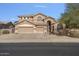 Two-story house with three-car garage and landscaping at 9348 E Grandview St, Mesa, AZ 85207