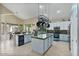 Large kitchen with island, blue cabinets, and pot rack at 9348 E Grandview St, Mesa, AZ 85207