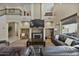 Living room with fireplace and built-in shelving at 9348 E Grandview St, Mesa, AZ 85207