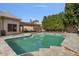 Refreshing swimming pool with a large patio and lush landscaping at 9348 E Grandview St, Mesa, AZ 85207