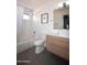 Clean bathroom with a bathtub, toilet, and modern vanity at 9573 E Dreyfus Pl, Scottsdale, AZ 85260