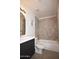 Updated bathroom with dark vanity and neutral tile at 9573 E Dreyfus Pl, Scottsdale, AZ 85260