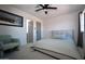 Bright bedroom featuring a comfy bed, armchair, and private bathroom access at 9573 E Dreyfus Pl, Scottsdale, AZ 85260