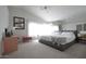 Spacious main bedroom with plush carpeting and large windows at 9573 E Dreyfus Pl, Scottsdale, AZ 85260